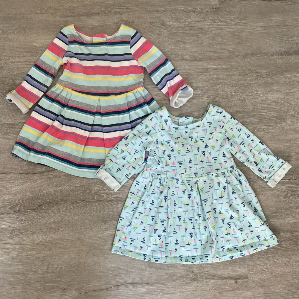 Pair of Cherokee dresses, 3/4 sleeve, blue with boats, and colorful stripes, 18m
